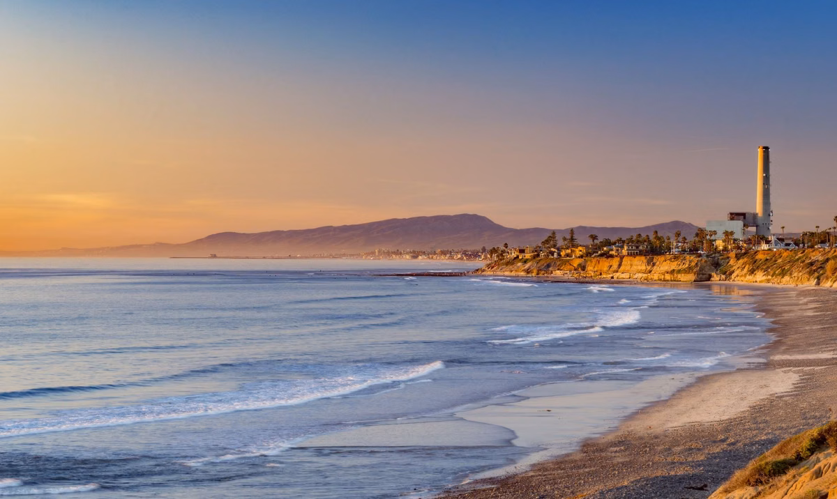 The bluff and beach at South Carlsbad State Beach at sunset